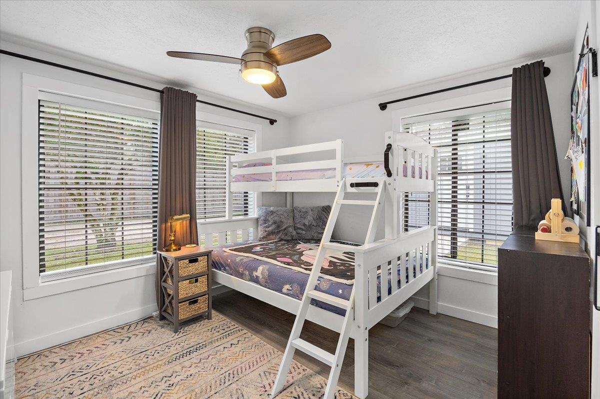 3181 Pacetti Road St. Augustine, FL 32092 - Photo 12 of 38 a bedroom with a bed next to a large window with wooden floor