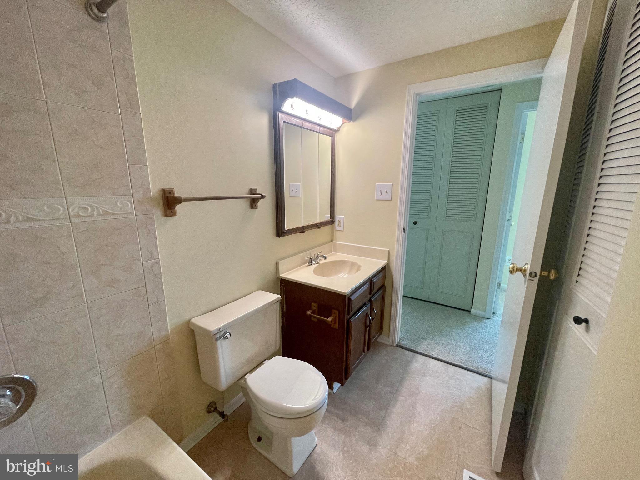 8604 Lawrence Hill Road Perry Hall, MD 21128 - Photo 19 of 38 a bathroom with a sink vanity mirror and toilet