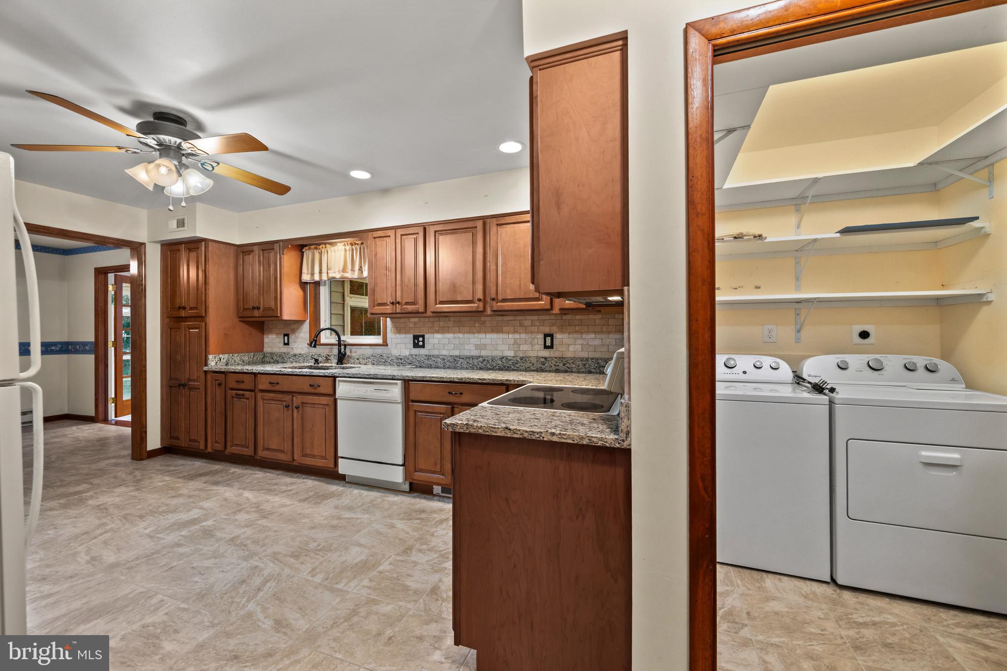 5313 Wentz Road Manchester, MD 21102 - Photo 39 of 51 a kitchen with a refrigerator sink and cabinets