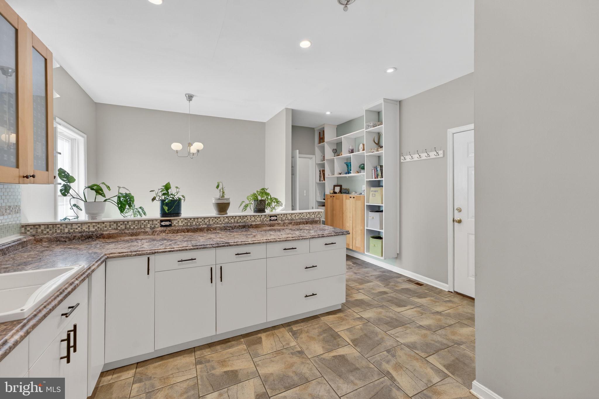 7453 Opal Road Warrenton, VA 20186 - Photo 16 of 53 a bathroom with a granite countertop sink and a mirror