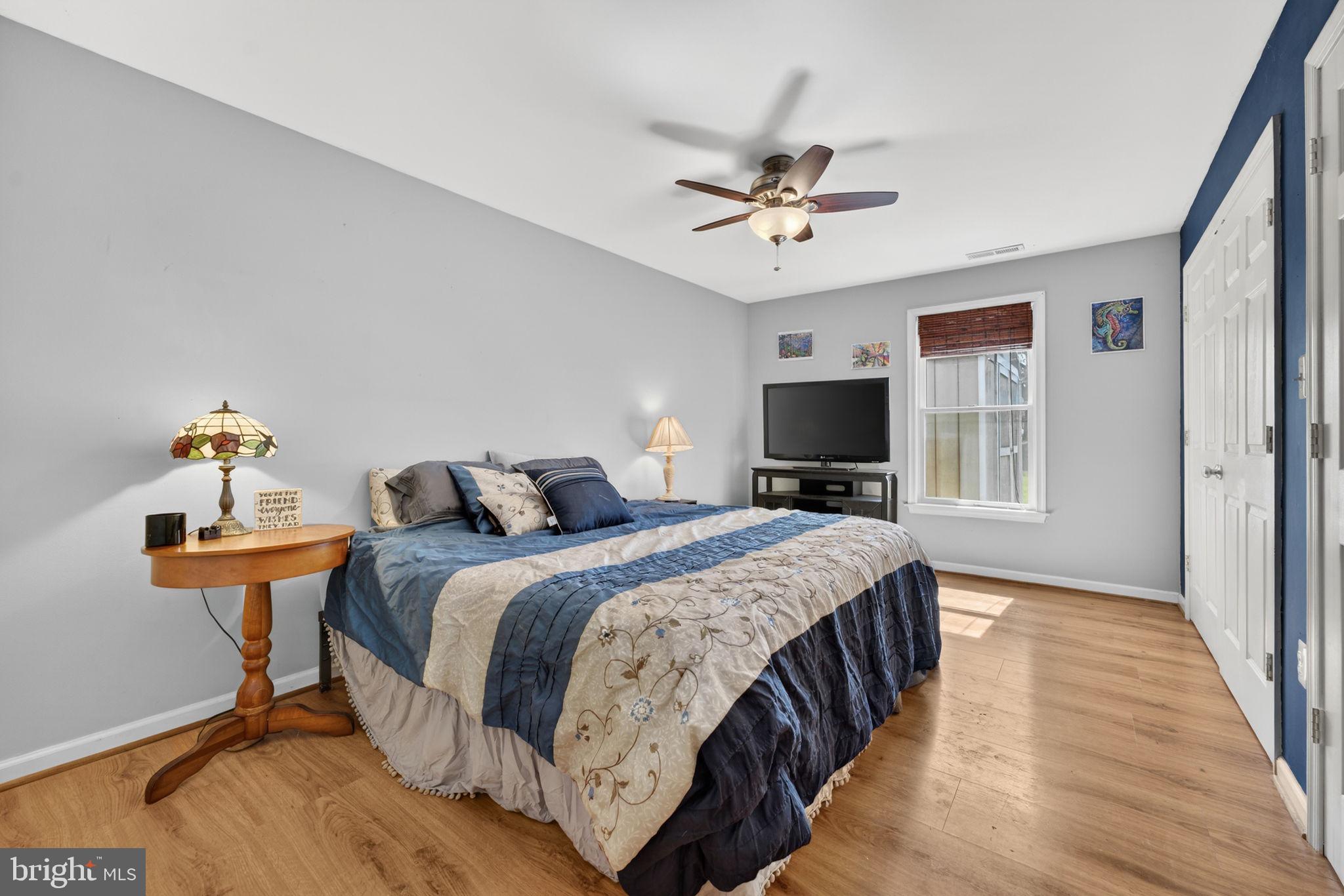 7453 Opal Road Warrenton, VA 20186 - Photo 23 of 53 a bedroom with a bed and wooden floor