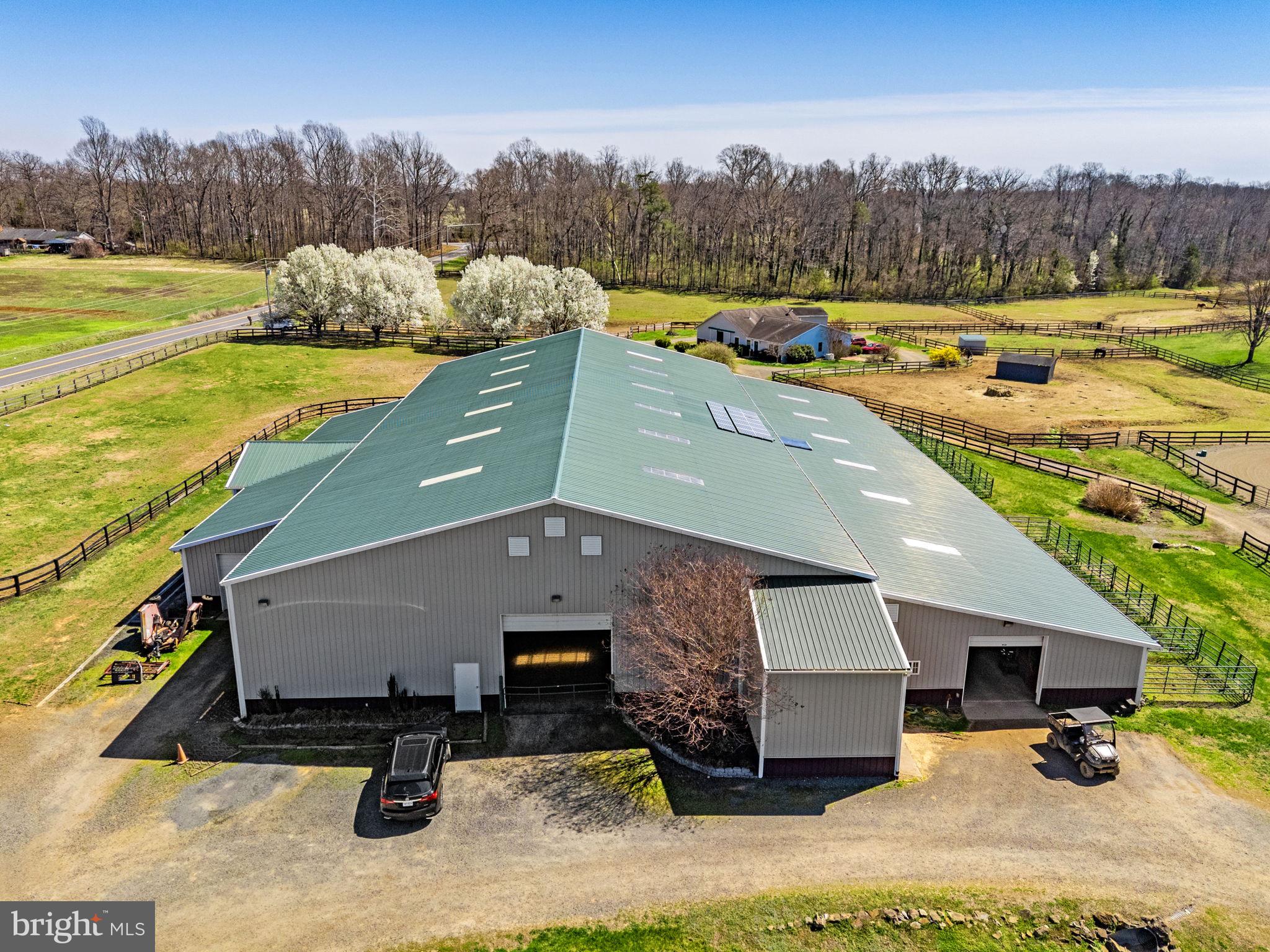 7453 Opal Road Warrenton, VA 20186 - Photo 31 of 53 a view of a swimming pool with an outdoor seating and a garden