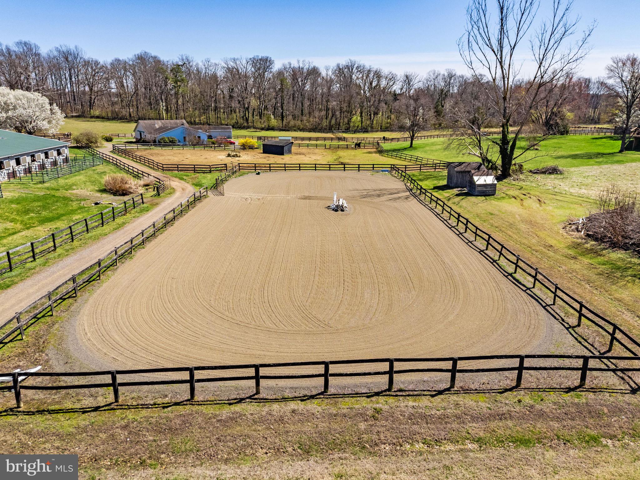 7453 Opal Road Warrenton, VA 20186 - Photo 34 of 53 a view of swimming pool with yard and trees in the background