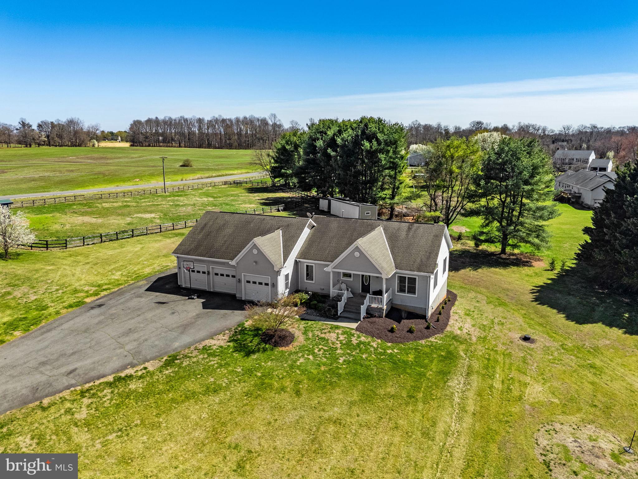 7453 Opal Road Warrenton, VA 20186 - Photo 4 of 53 an aerial view of a house with garden space and ocean view