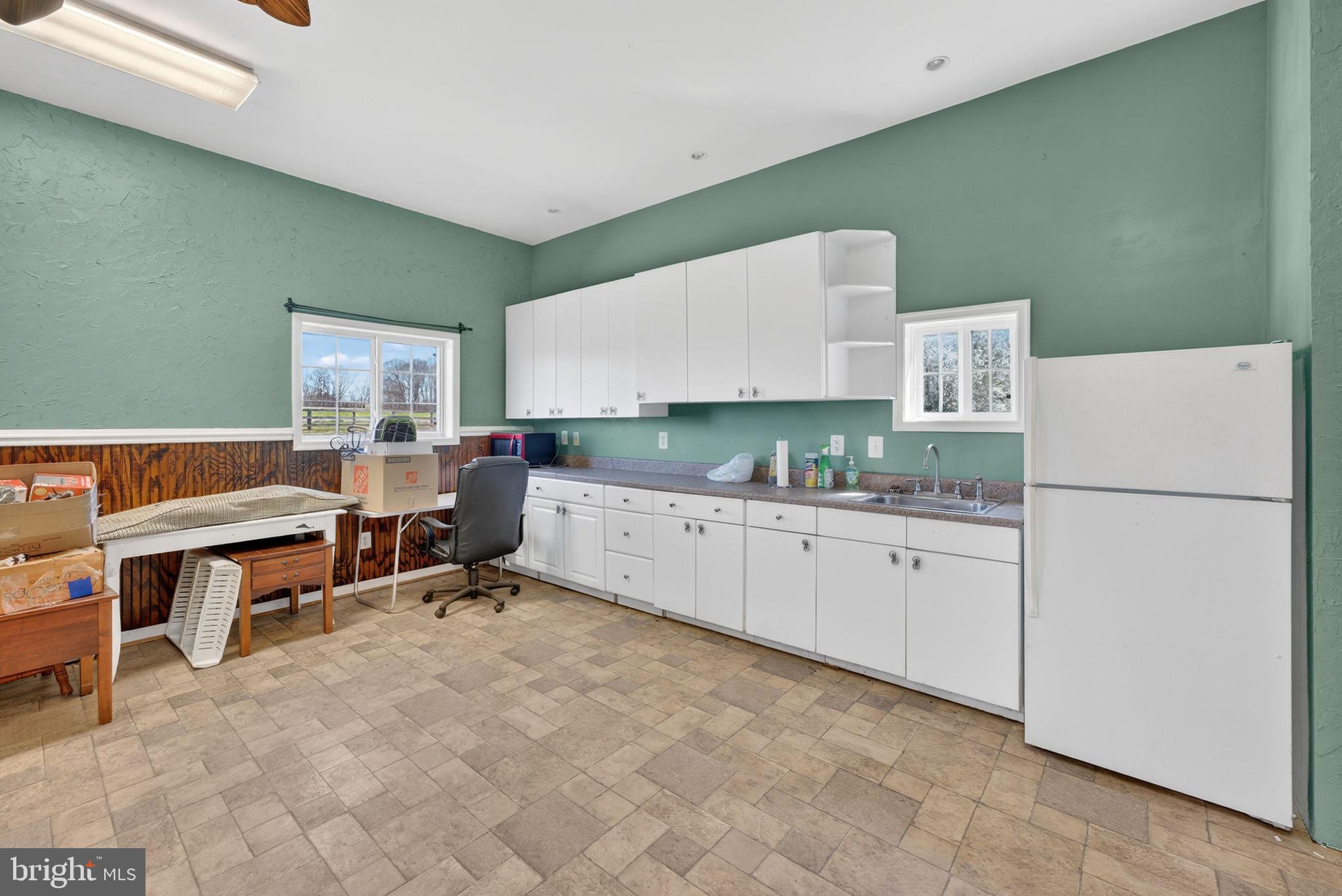 7453 Opal Road Warrenton, VA 20186 - Photo 46 of 53 a room with furniture a washer and dryer