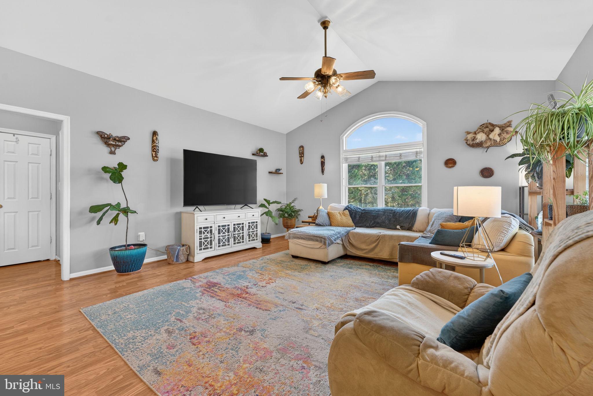 7453 Opal Road Warrenton, VA 20186 - Photo 6 of 53 a living room with furniture and a flat screen tv