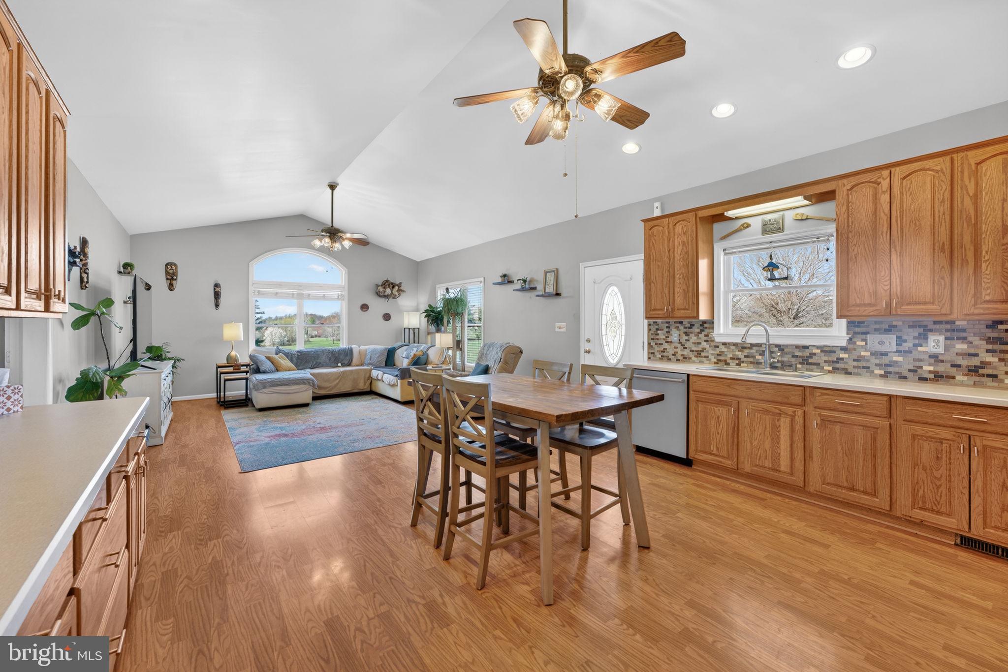 7453 Opal Road Warrenton, VA 20186 - Photo 10 of 53 a view of a dining room with furniture window and wooden floor