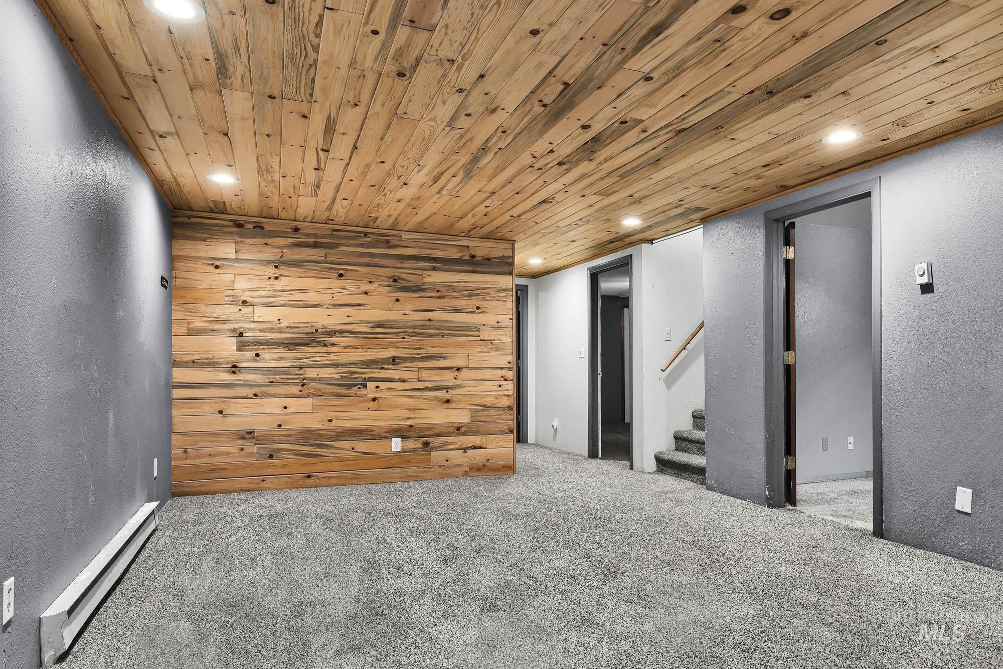 808 North A Street Parma, ID 83660 - Photo 17 of 29 Reclaimed wood-finish accent wall with coordinating wood-finish ceiling