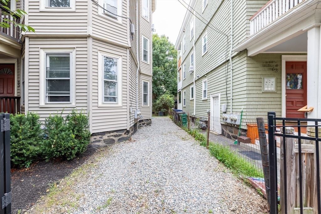 65-67 Allston Street, Unit 1 Cambridge, MA 02139 - Photo 2 of 13 a view of a house with backyard and a trees