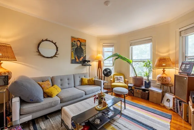 a living room with furniture and a table