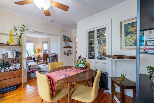 a view of a dining room with furniture and window