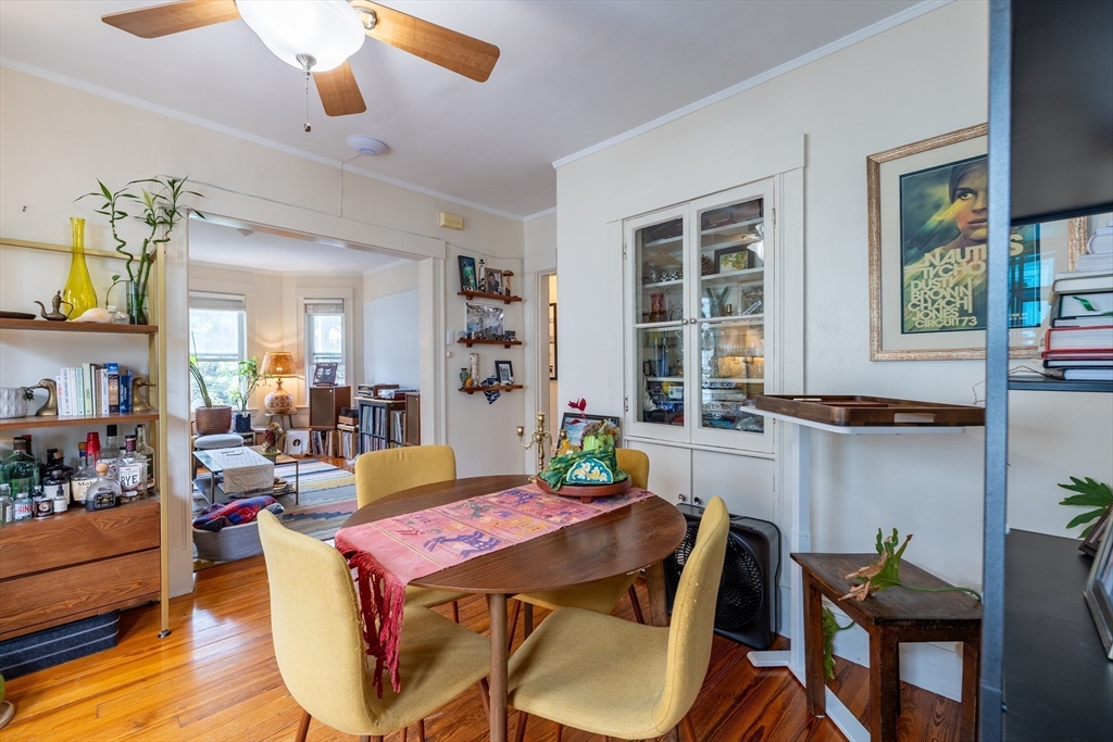 65-67 Allston Street, Unit 1 Cambridge, MA 02139 - Photo 5 of 13 a view of a dining room with furniture and window