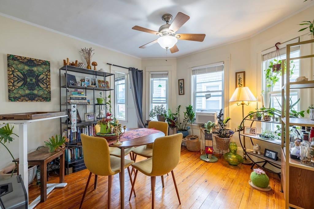 65-67 Allston Street, Unit 1 Cambridge, MA 02139 - Photo 6 of 13 a view of a dining room with furniture window and outside view