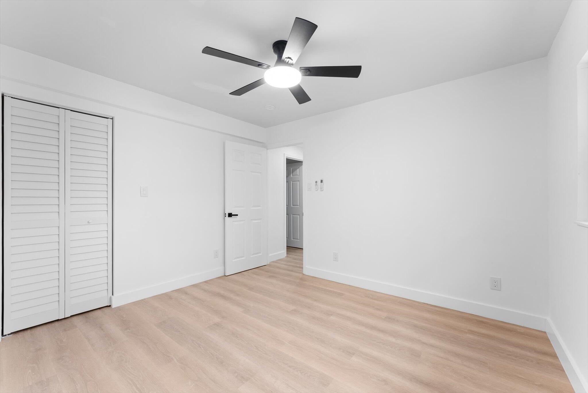 1891 Ridge Road North Palm Beach, FL 33408 - Photo 11 of 24 wooden floor in an empty room