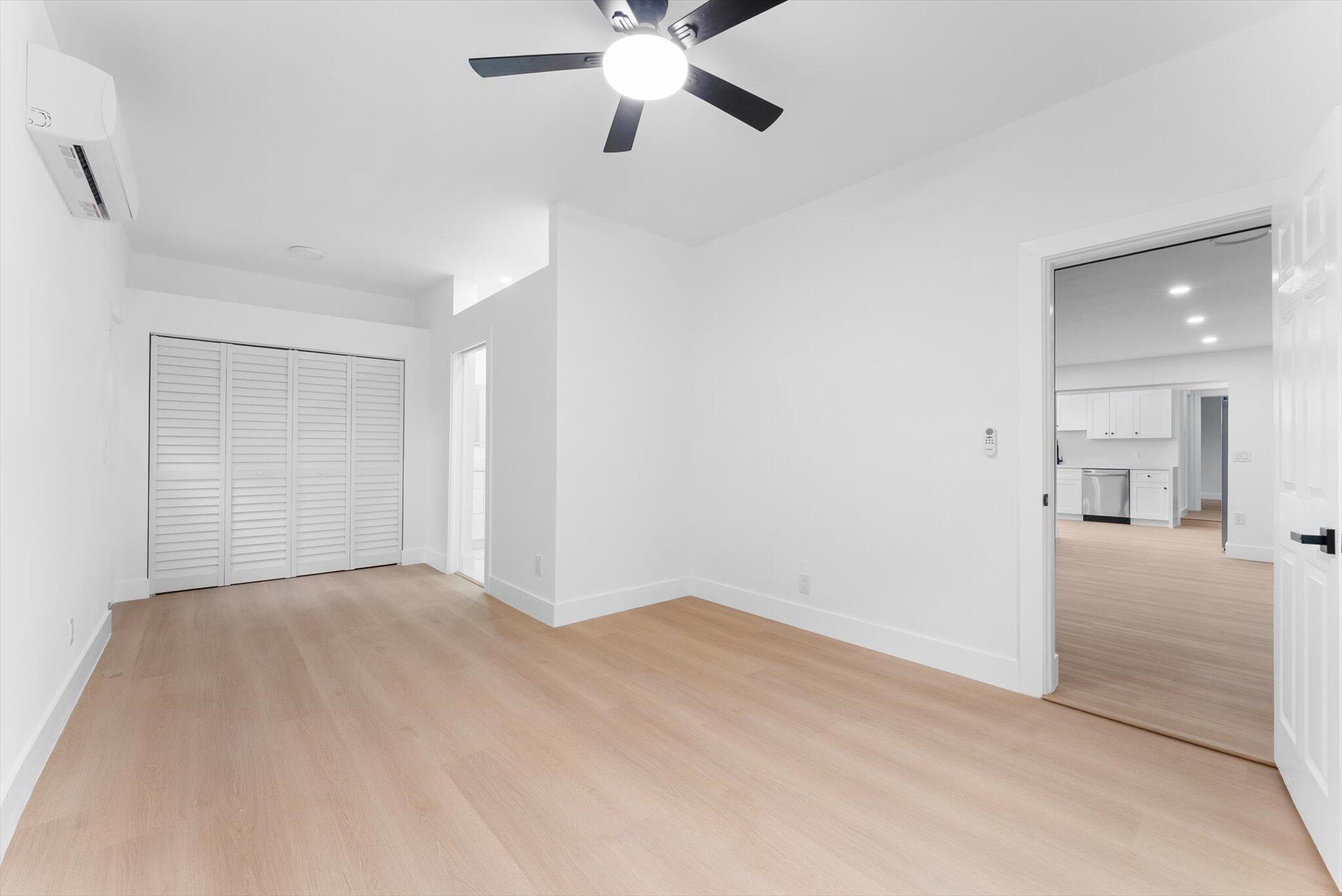 1891 Ridge Road North Palm Beach, FL 33408 - Photo 13 of 24 a view of a livingroom with a ceiling fan and window
