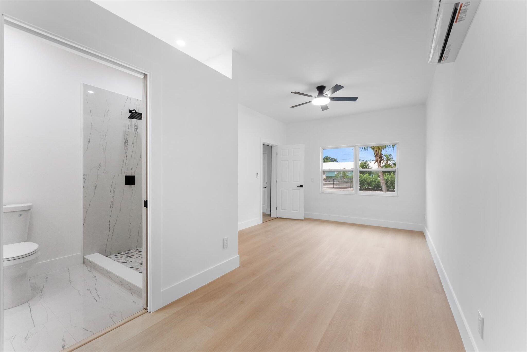 1891 Ridge Road North Palm Beach, FL 33408 - Photo 14 of 24 a view of a bathroom with a shower and a toilet