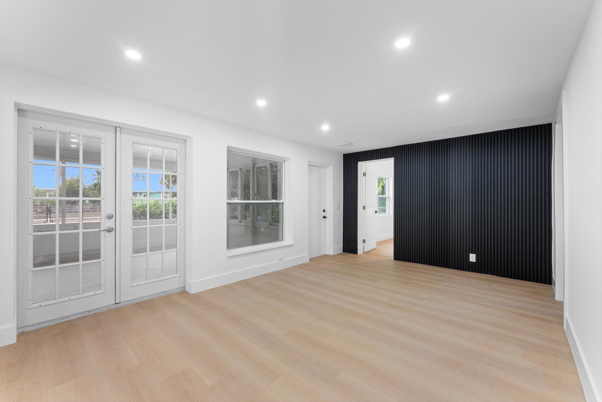 1891 Ridge Road North Palm Beach, FL 33408 - Photo 2 of 24 a view of an empty room with a window and cabinet