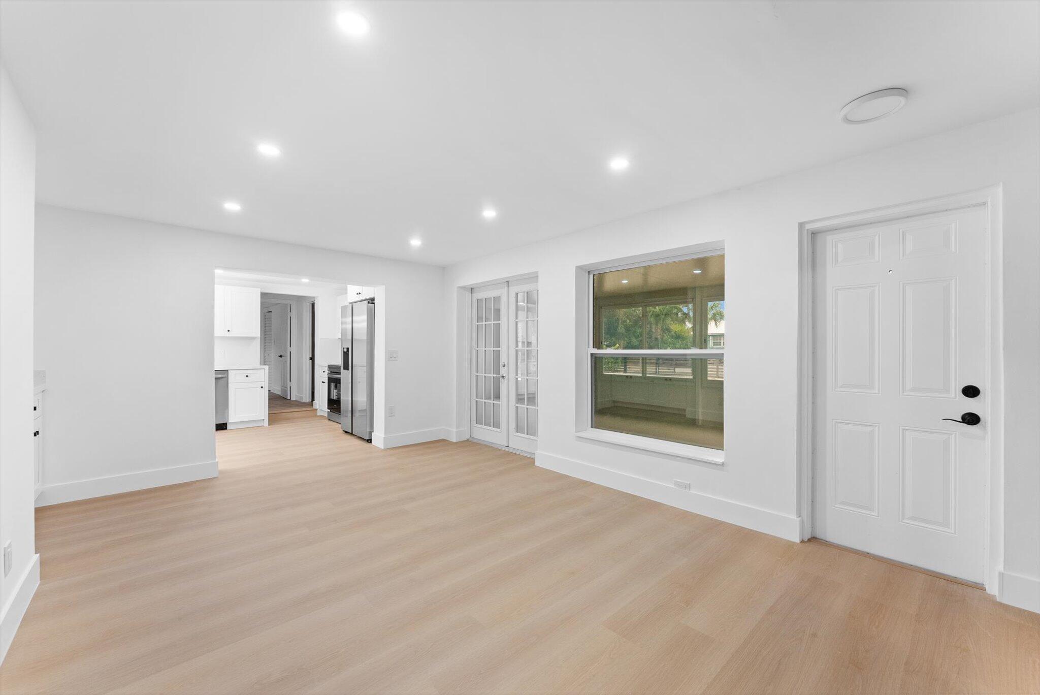 1891 Ridge Road North Palm Beach, FL 33408 - Photo 3 of 24 a view of an empty room with a window