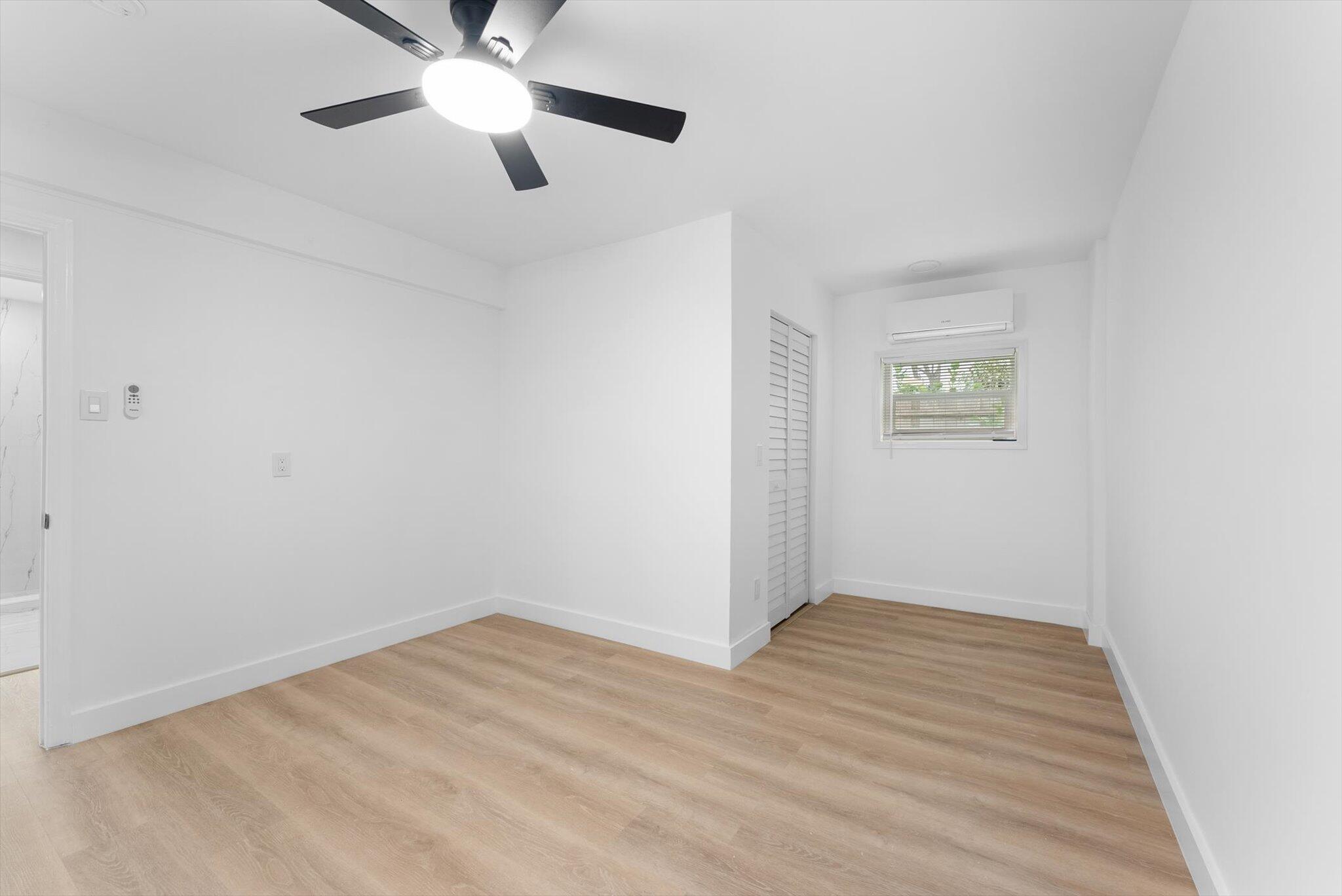 1891 Ridge Road North Palm Beach, FL 33408 - Photo 8 of 24 a view of empty room with wooden floor