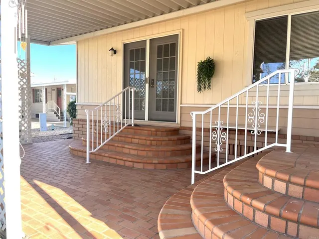 a view of a balcony with a potted plant