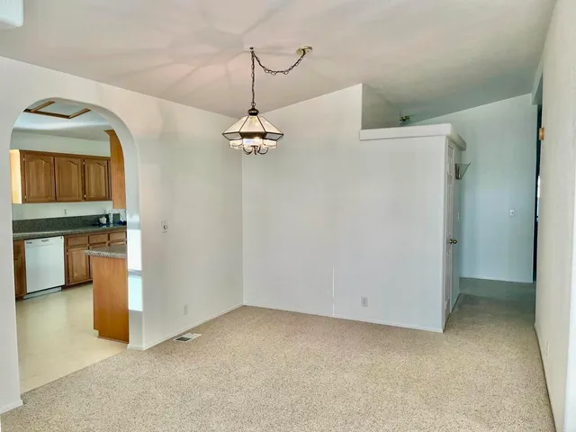 a view of a livingroom with wooden floor