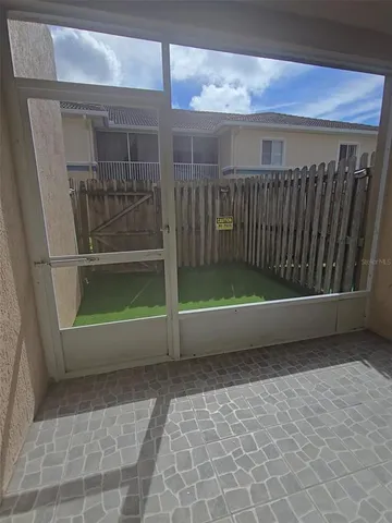 a view of backyard and porch
