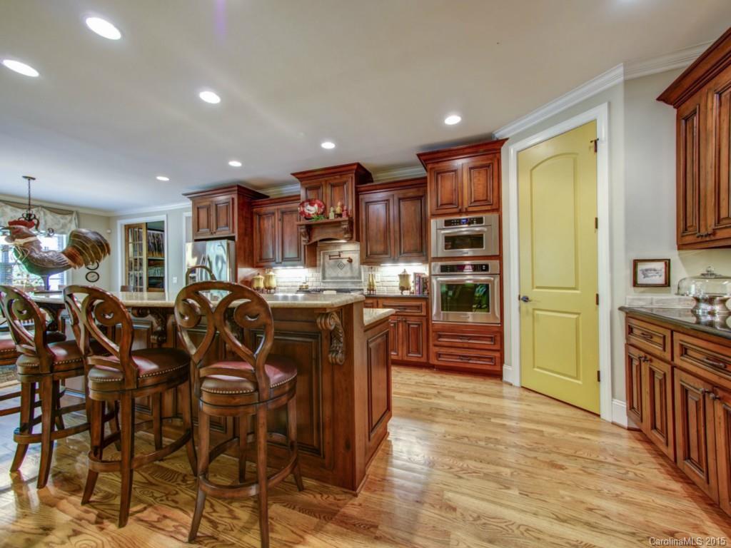4706 River Oaks Road Clover, SC 29710 - Photo 5 of 24 a kitchen with stainless steel appliances kitchen island granite countertop a refrigerator and cabinets