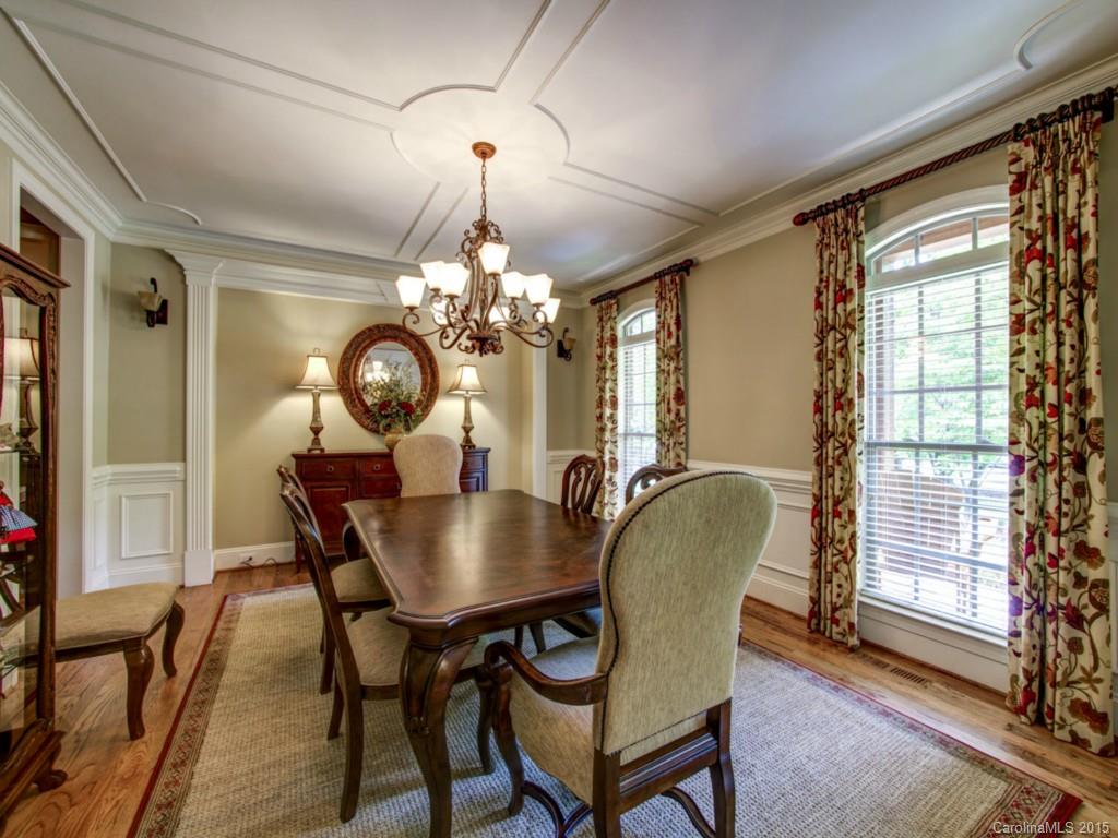 4706 River Oaks Road Clover, SC 29710 - Photo 8 of 24 a dining room with furniture a chandelier and wooden floor