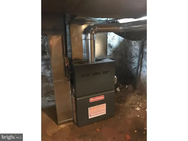 a bathroom with a light fixture and a mirror