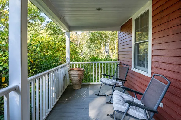 a view of a two chairs in the balcony
