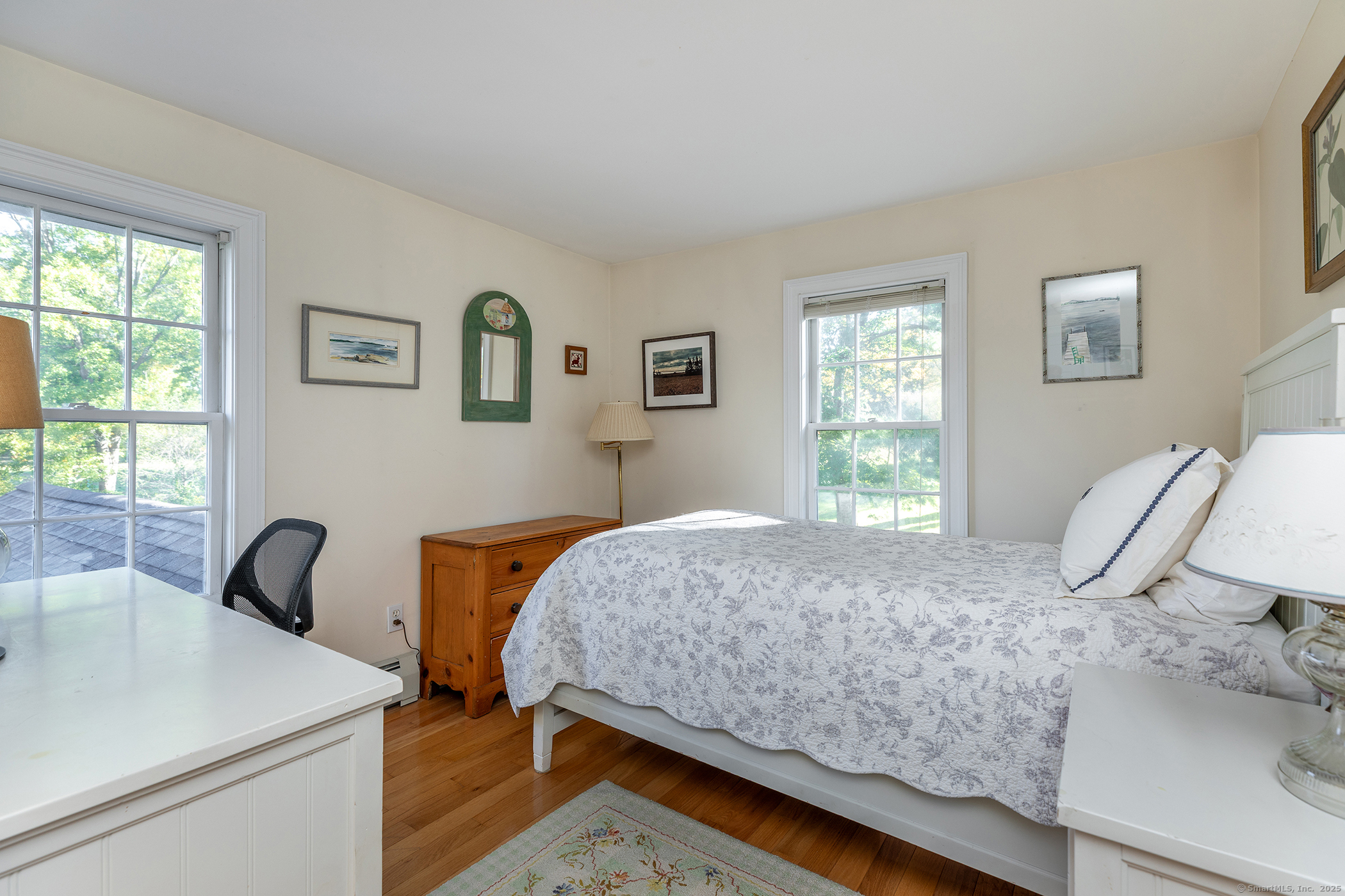 62 Brush Hill Road Litchfield, CT 06759 - Photo 22 of 23 a bedroom with a bed and a window with wooden floor