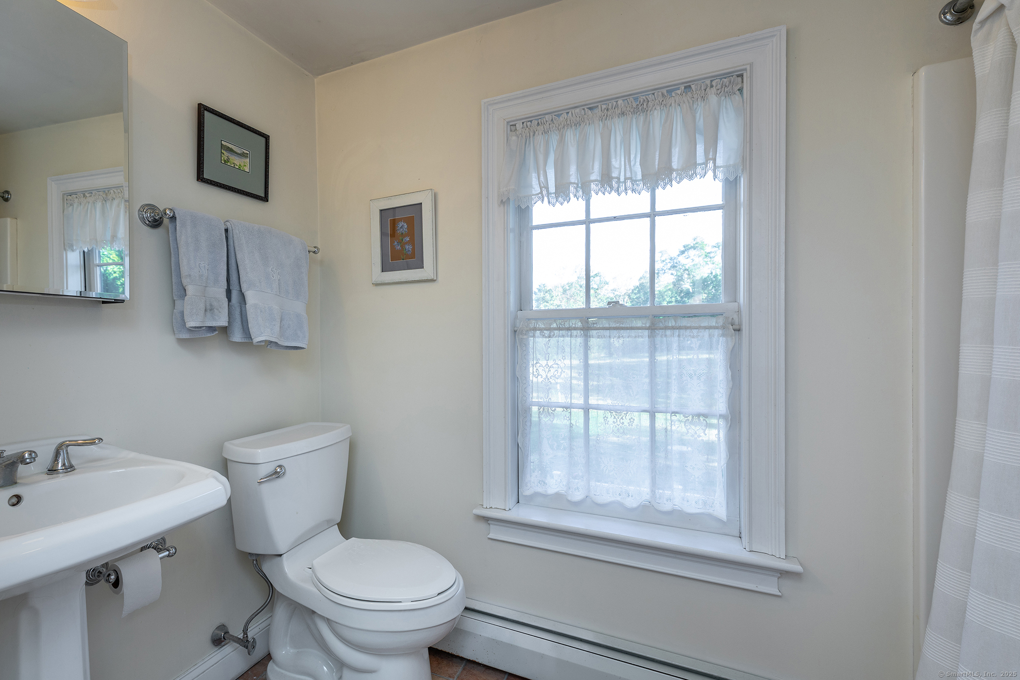 62 Brush Hill Road Litchfield, CT 06759 - Photo 23 of 23 a bathroom with a toilet a sink a window and mirror