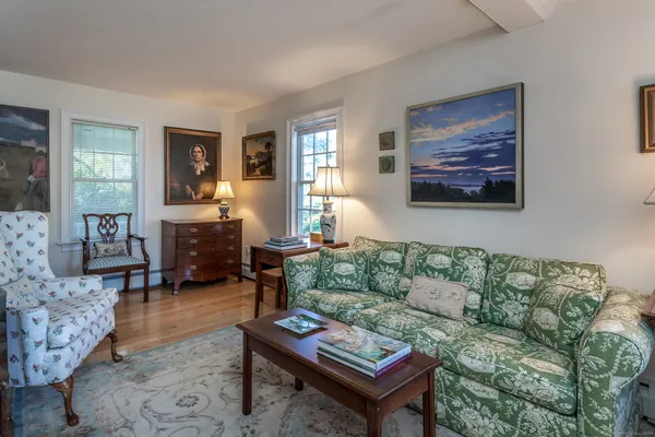 a living room with furniture and a rug