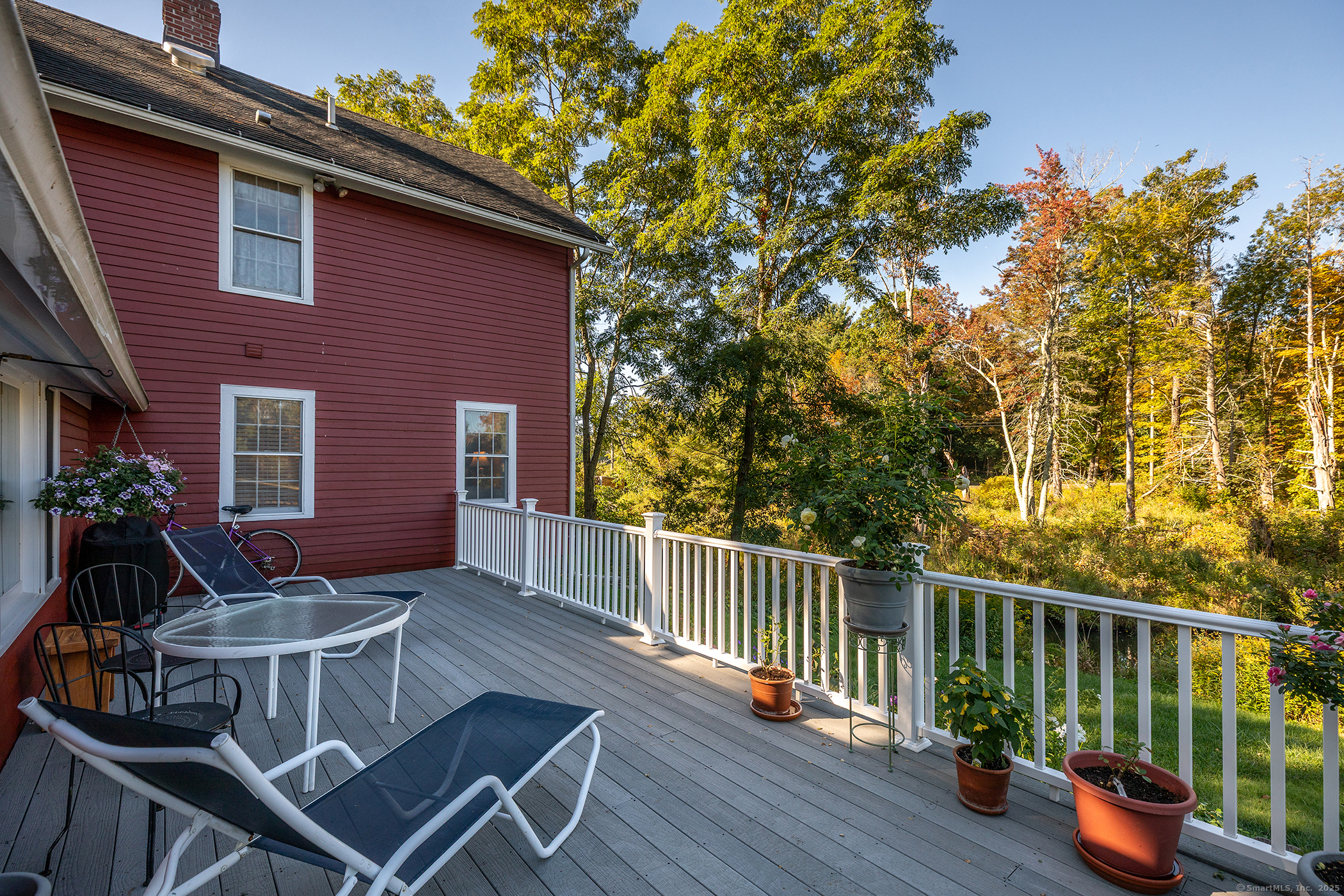 62 Brush Hill Road Litchfield, CT 06759 - Photo 8 of 23 a view of a chairs and table in the balcony