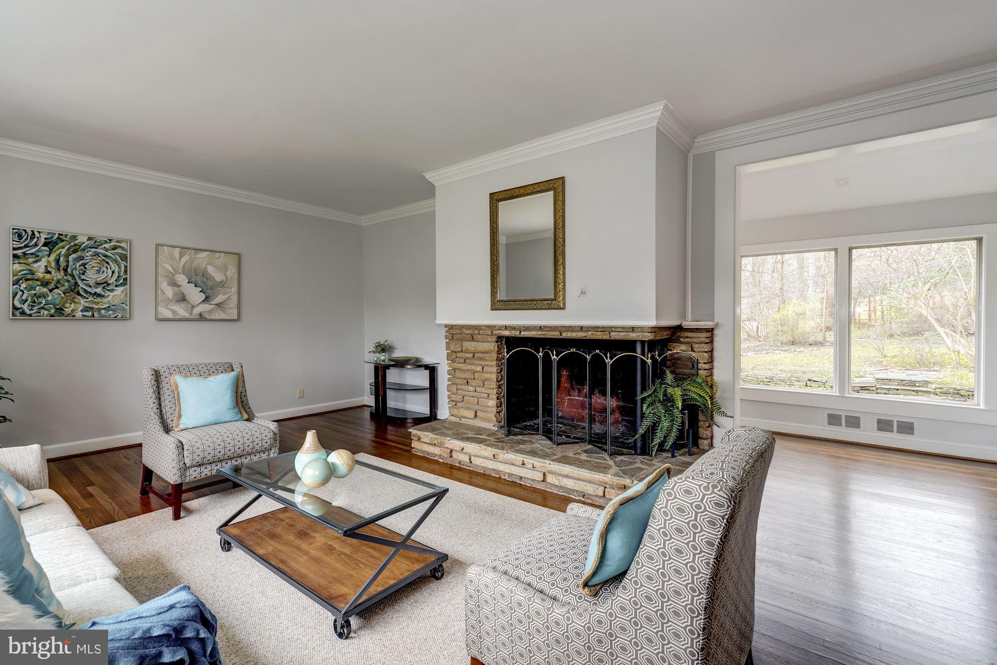 6520 Greentree Road Bethesda, MD 20817 - Photo 2 of 25 Living Room w/stone FPL, crown molding & hardwoods