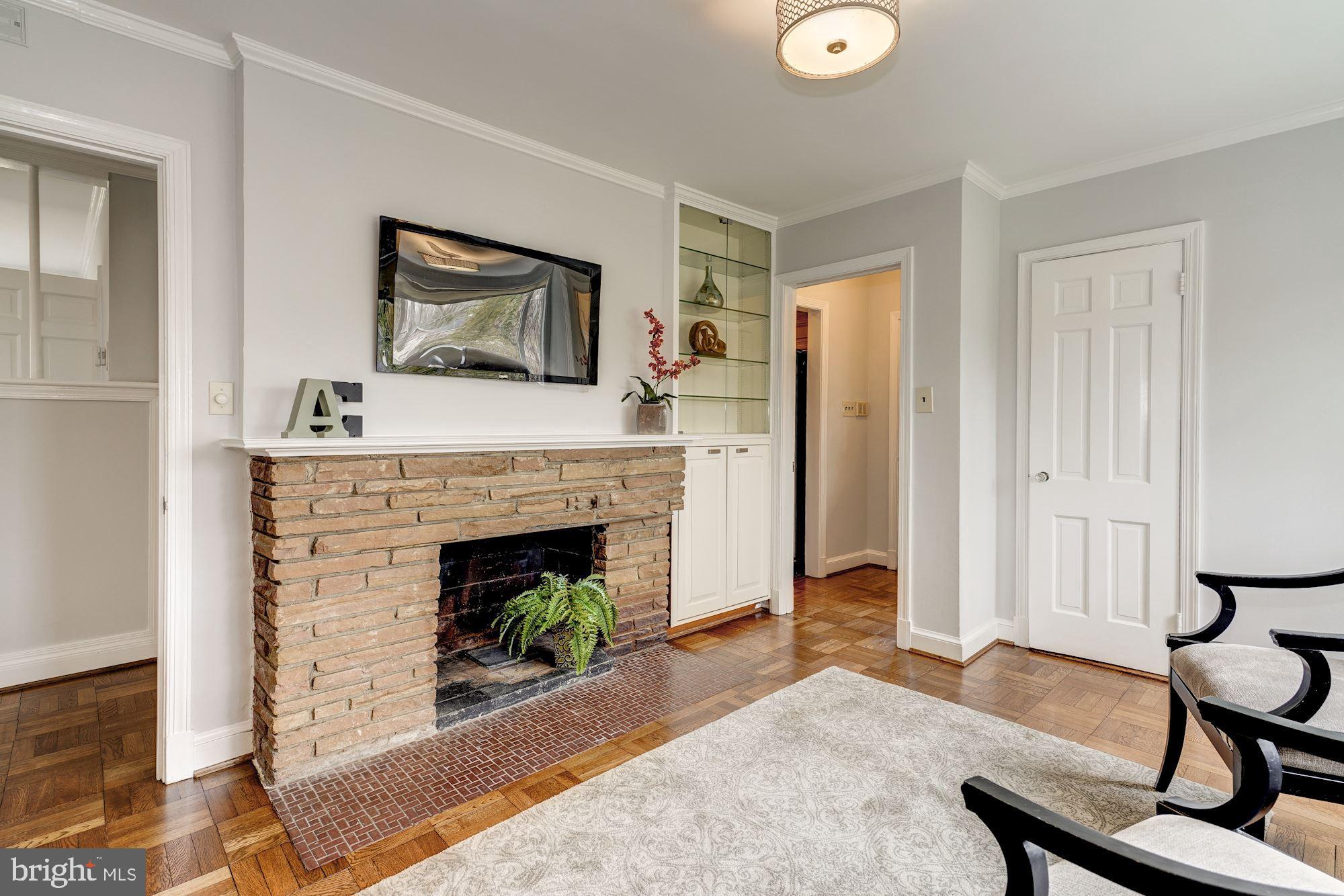 6520 Greentree Road Bethesda, MD 20817 - Photo 11 of 25 Sitting Room/Den features stone fireplace
