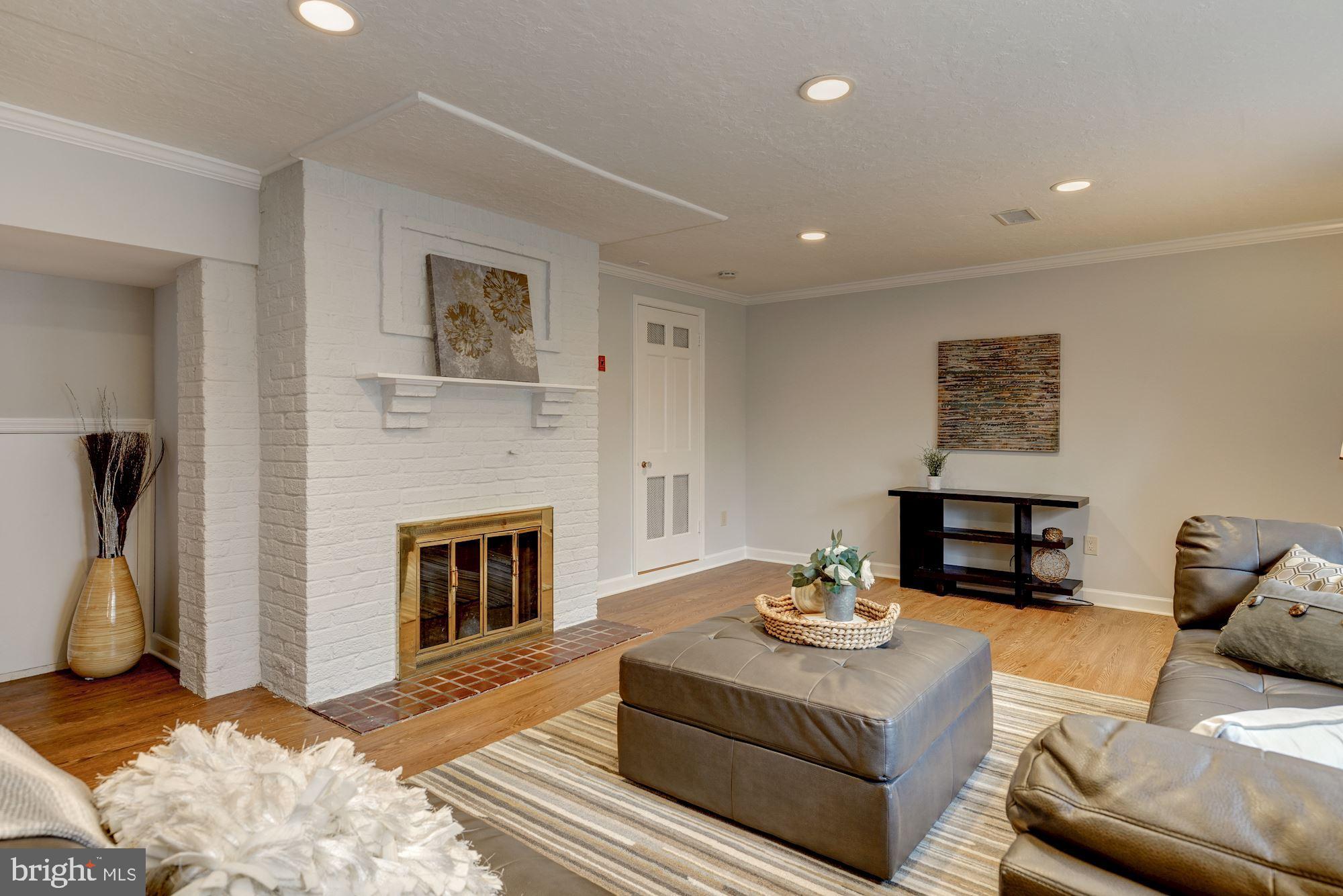 6520 Greentree Road Bethesda, MD 20817 - Photo 20 of 25 Lower Level Family Room w/brick fireplace
