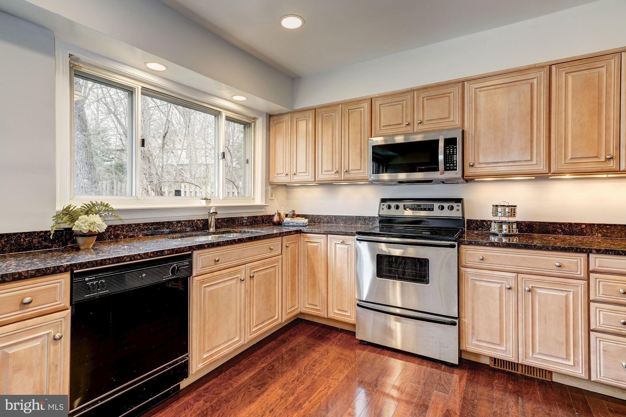 6520 Greentree Road Bethesda, MD 20817 - Photo 7 of 25 Kitchen features granite counter & custom cabinets