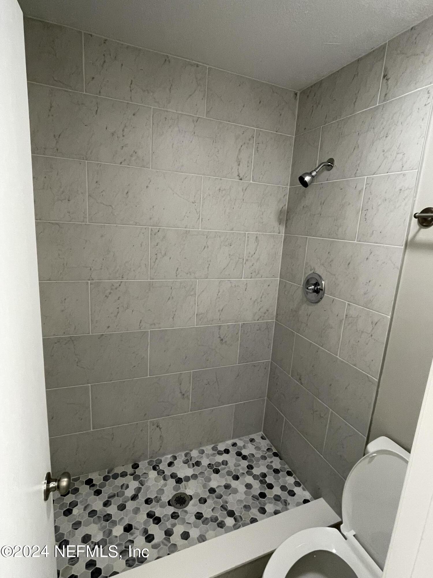 4535 Chipmunk Road Middleburg, FL 32068 - Photo 15 of 26 a bathroom with a sink toilet and shower