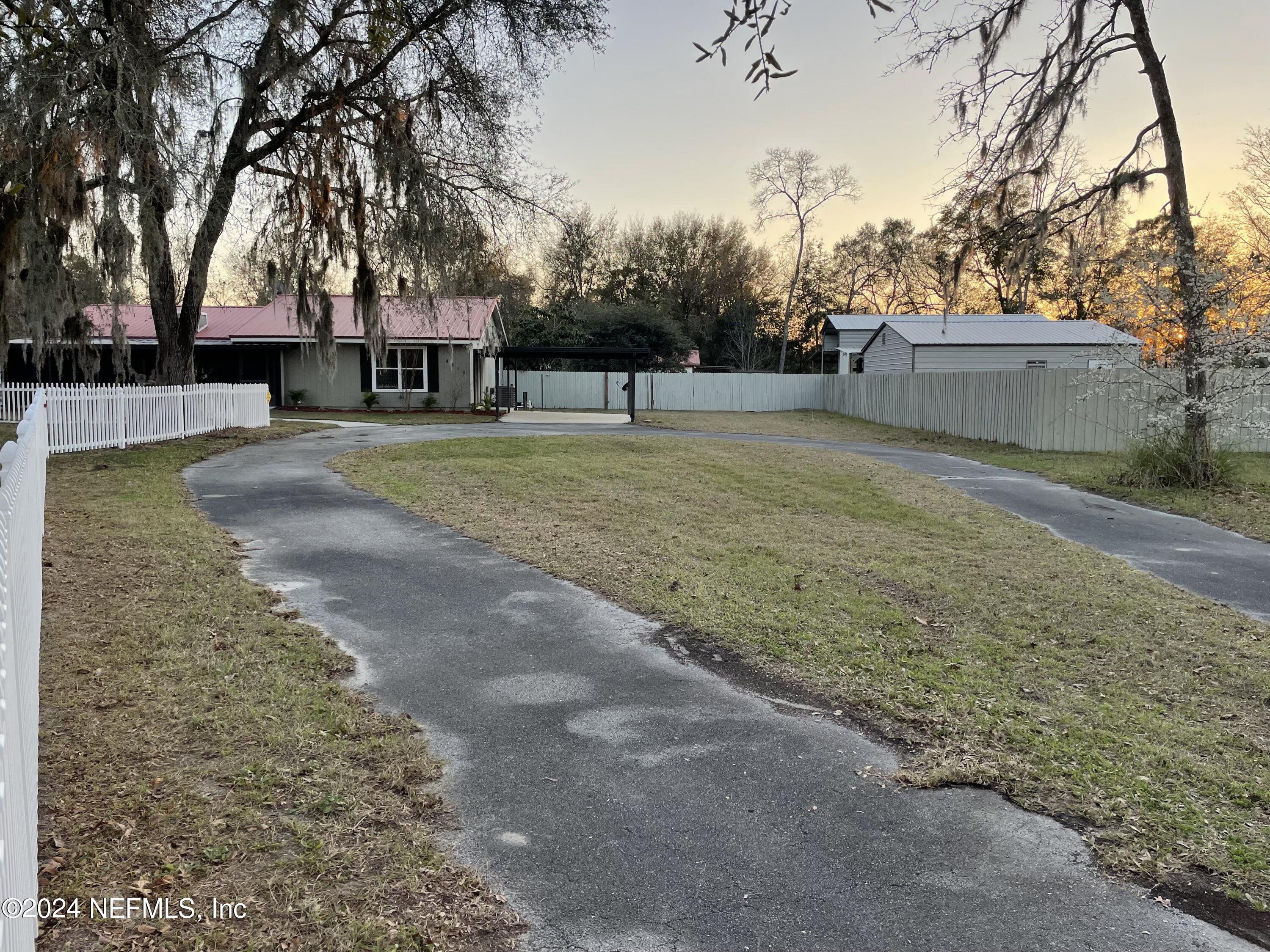 4535 Chipmunk Road Middleburg, FL 32068 - Photo 2 of 26 a view of a house with a yard
