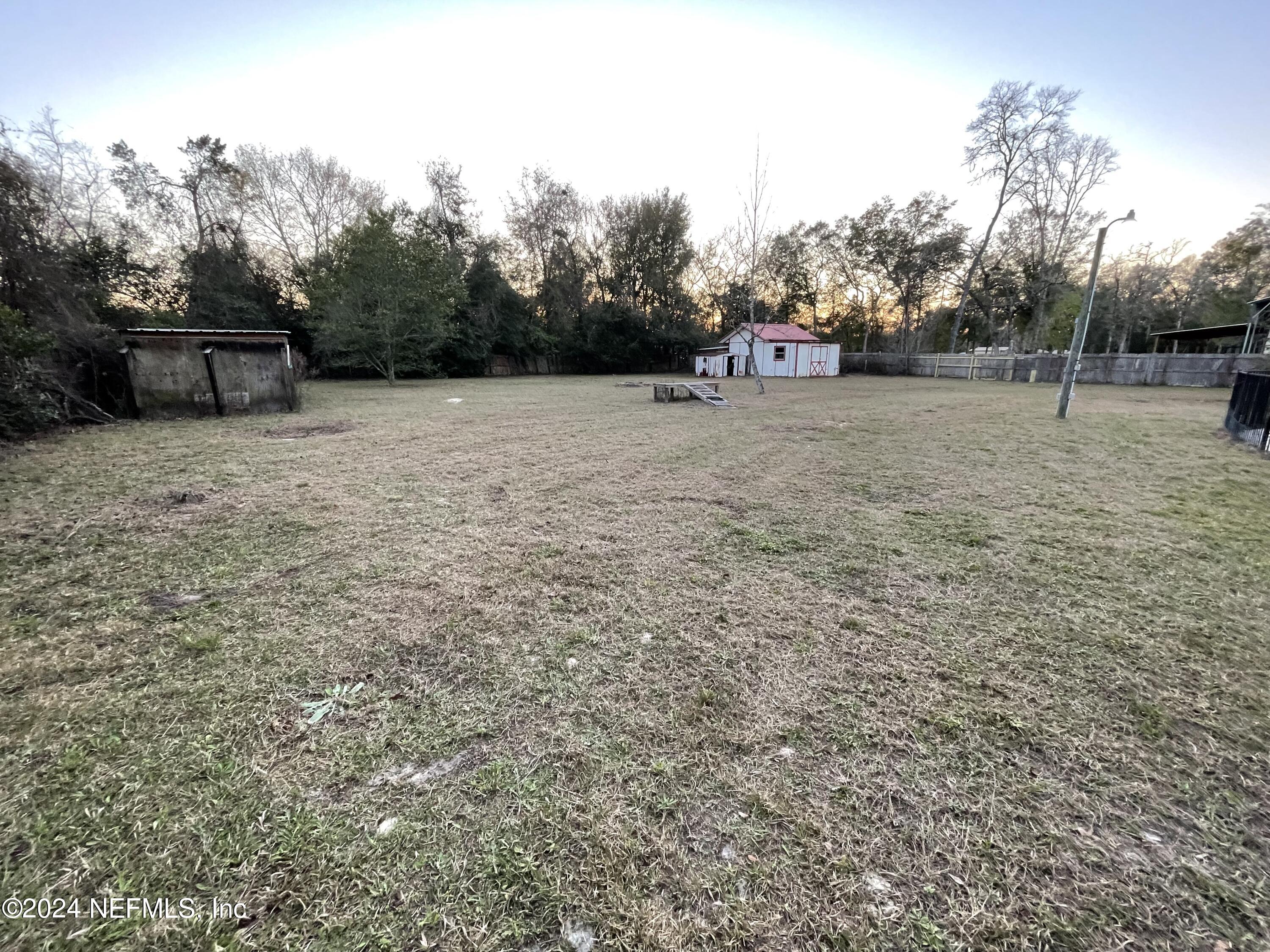 4535 Chipmunk Road Middleburg, FL 32068 - Photo 23 of 26 a view of outdoor space with deck and yard