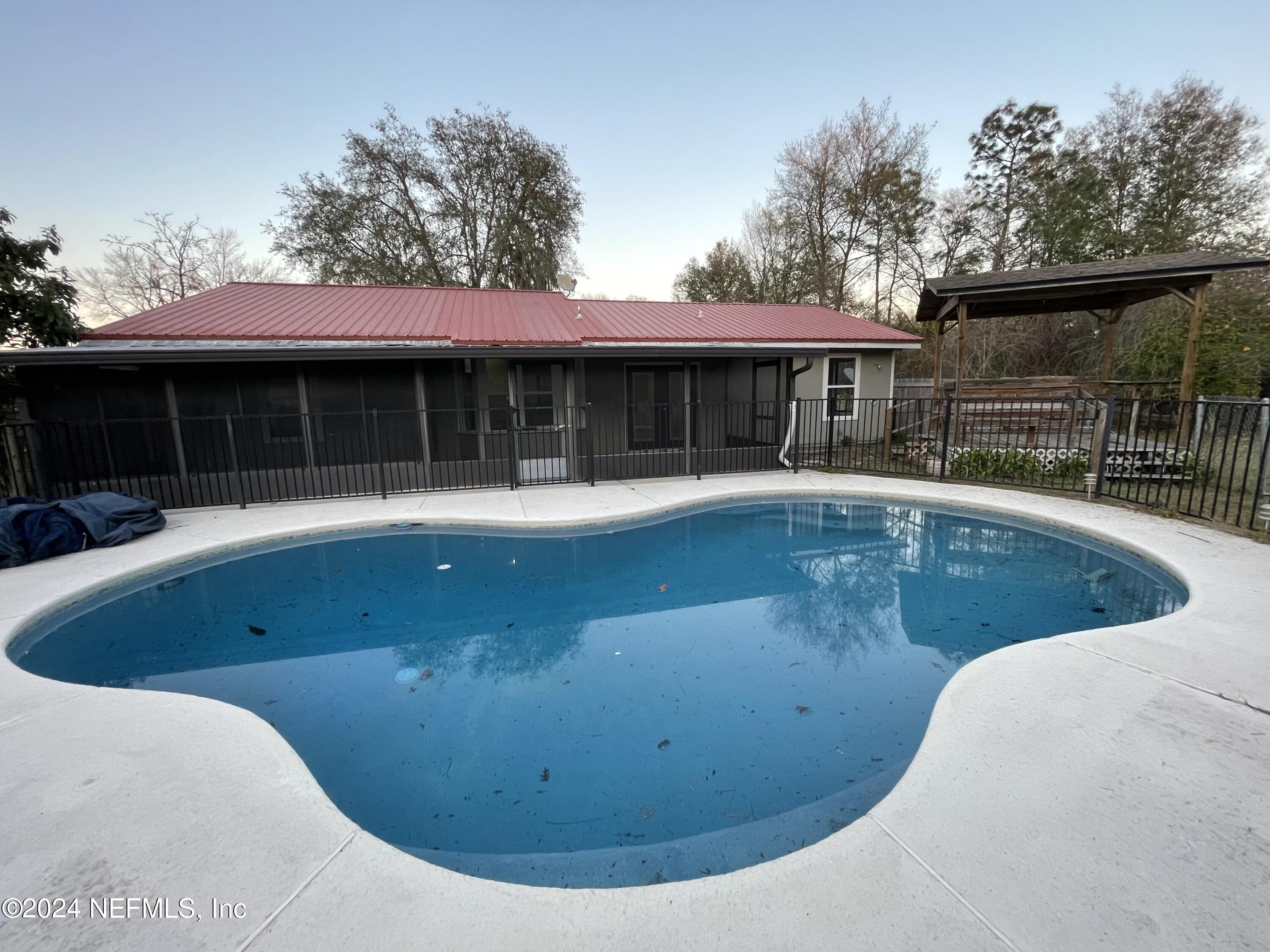 4535 Chipmunk Road Middleburg, FL 32068 - Photo 26 of 26 a view of a swimming pool with a patio