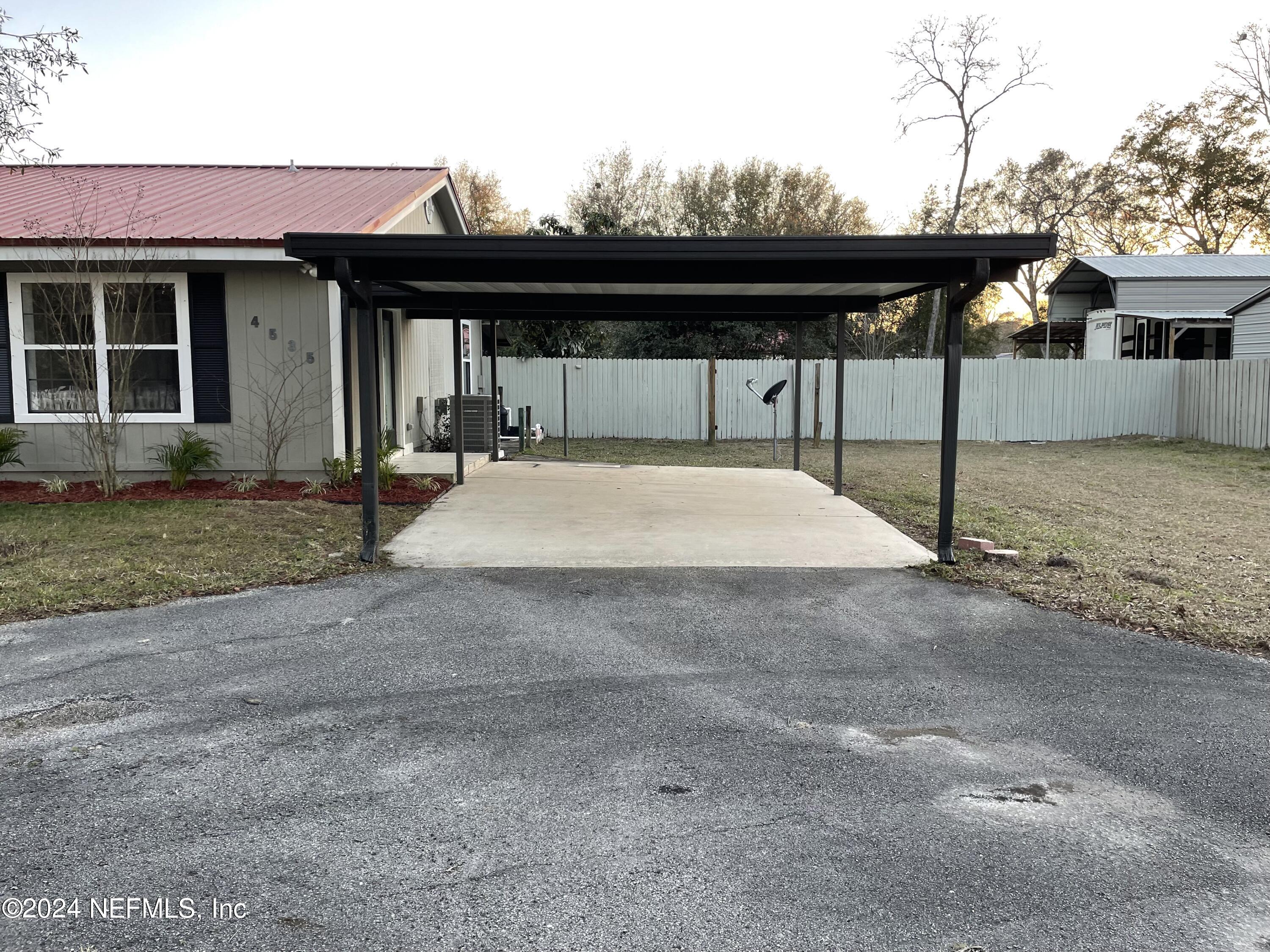 4535 Chipmunk Road Middleburg, FL 32068 - Photo 4 of 26 a front view of a house with porch