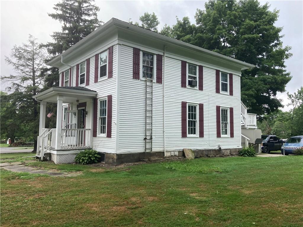 12 Lake Road Hadley, PA 16130 - Photo 3 of 10 a front view of a house with a garden