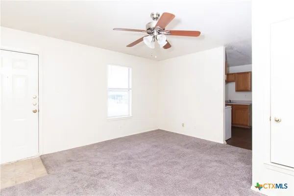 a view of an empty room with a window