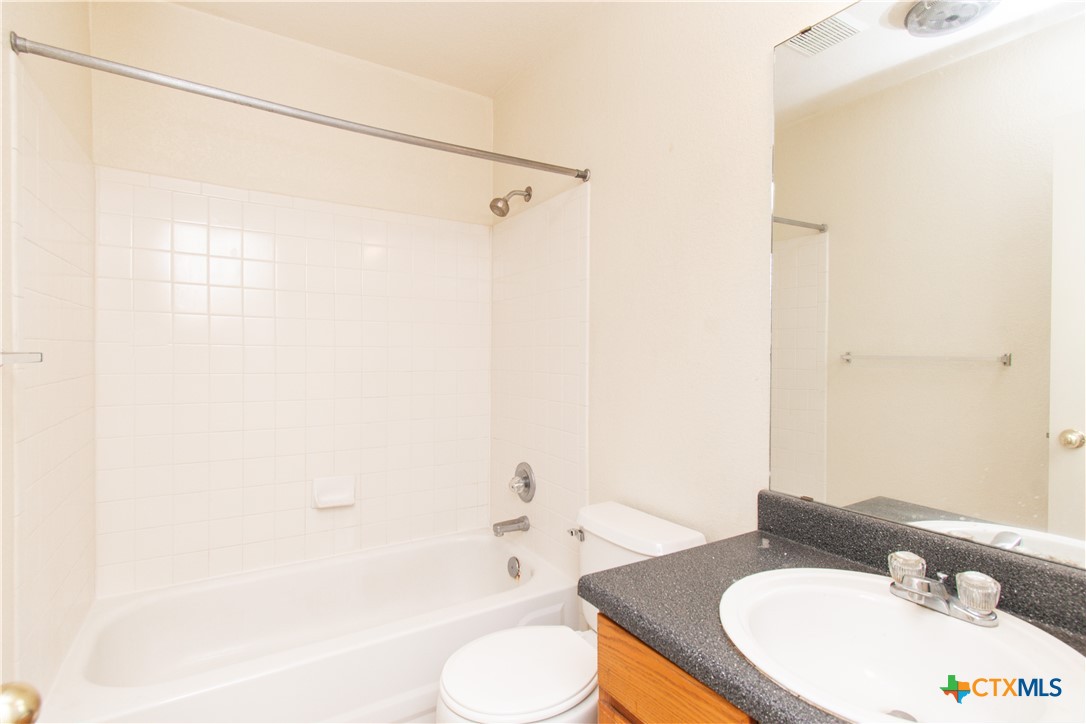 2014 Cedarhill Drive, Unit C Killeen, TX 76543 - Photo 9 of 12 a bathroom with a sink and a mirror
