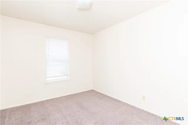 a view of a room with a hallway