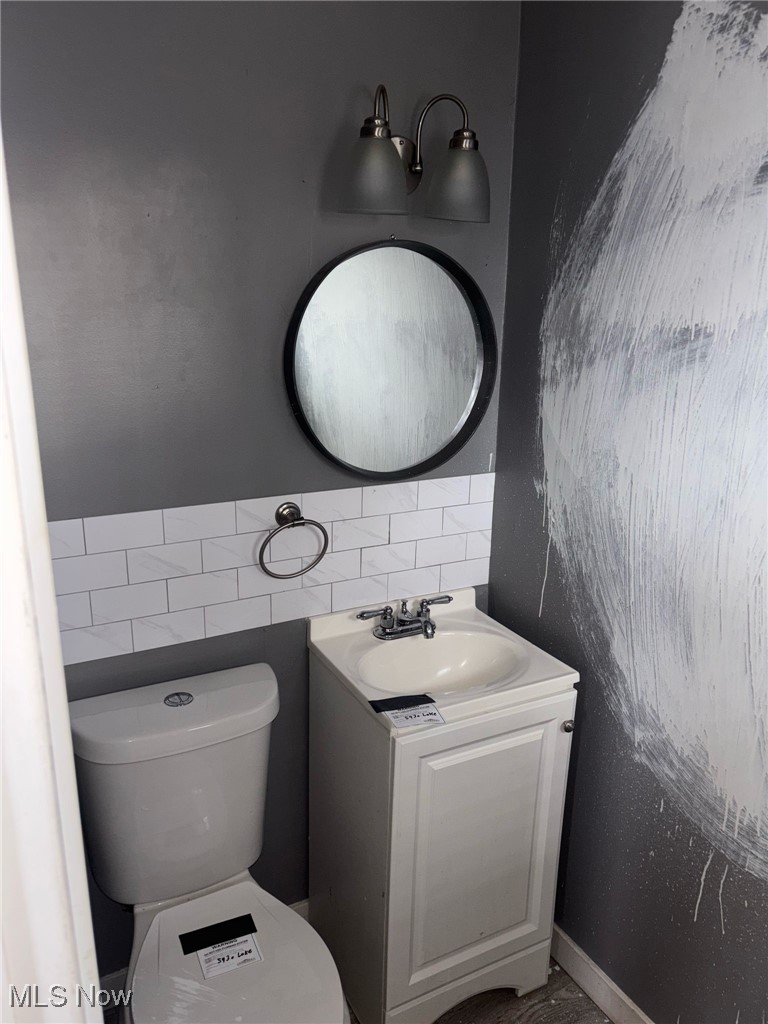 5930 Lake Road Mentor, OH 44060 - Photo 2 of 11 Bathroom with vanity and tile walls