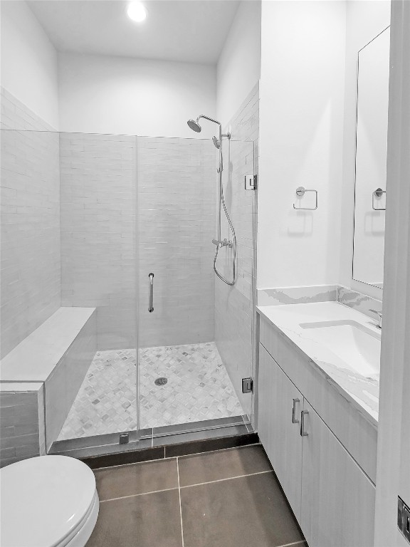 3807 Threadgill Street Austin, TX 78723 - Photo 15 of 36 a bathroom with a granite countertop sink a toilet and shower