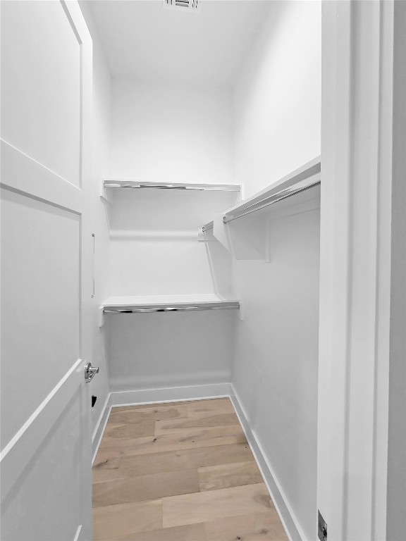 3807 Threadgill Street Austin, TX 78723 - Photo 16 of 36 a view of walk in closet with empty racks